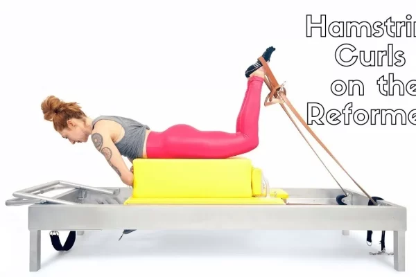 bai-tap-pilates-hamstring-curls-tren-reformer