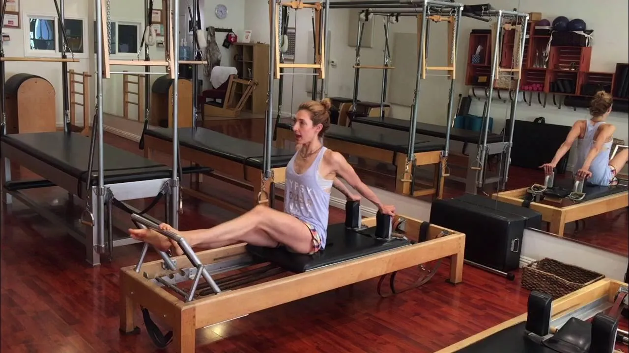 bai-tap-pilates-single-leg-stomach-massage-tren-reformer-2