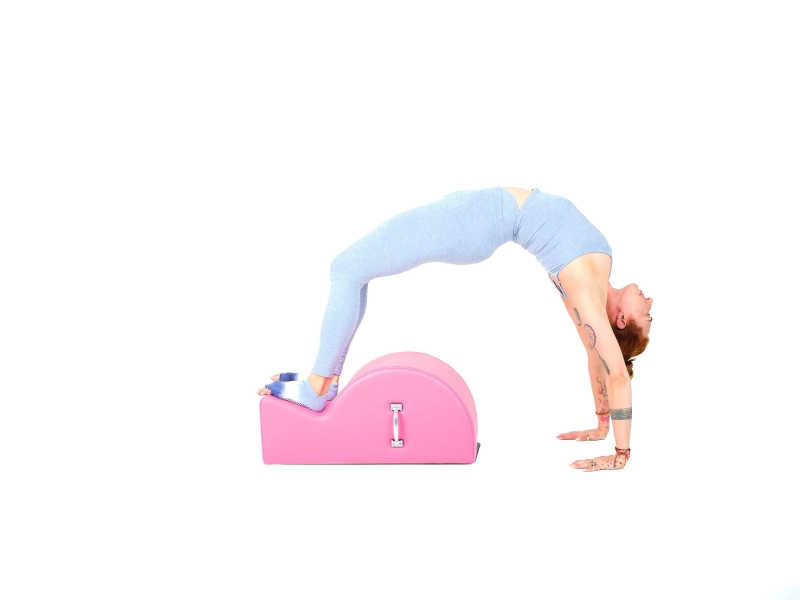 Bài tập Pilates High Bridge trên Spine Corrector