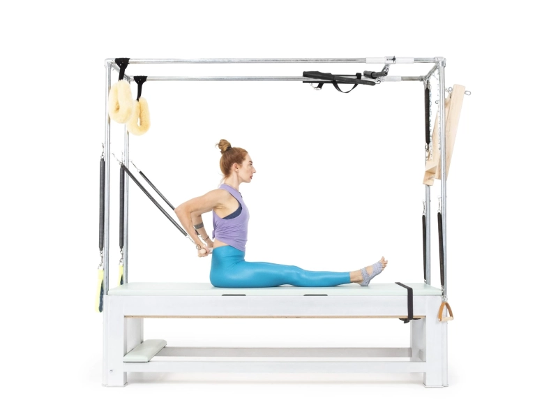 Lợi ích của bài tập Long Back Arms Seated with Roll Back Bar trên Cadillac
