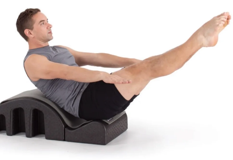 Pilates Hundred exercise on the Spine Corrector.