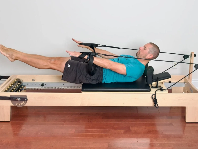 Pilates Hundred exercise on the Reformer.