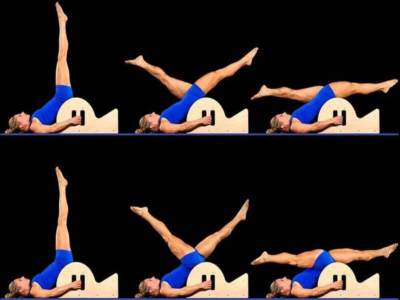 Perform Pilates Scissors on the Spine Corrector