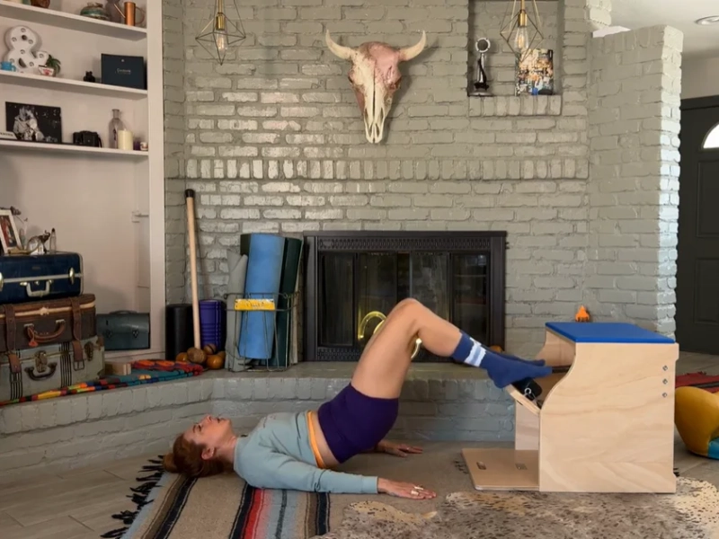 Pilates Shoulder Bridge exercise on the Wunda Chair