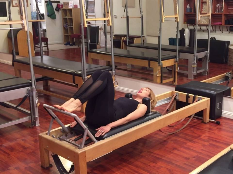 Leg Circles exercise using the Reformer machine.