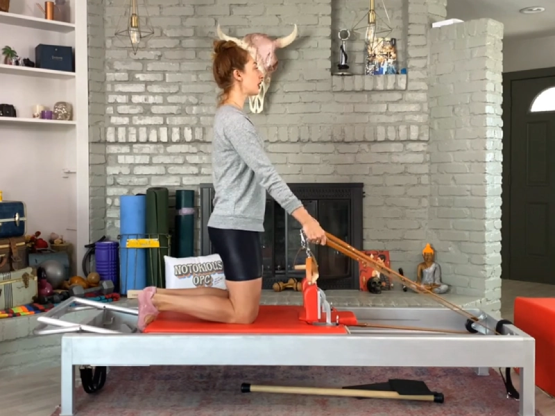 Steps to perform the Pilates Chest Expansion exercise on a Reformer.