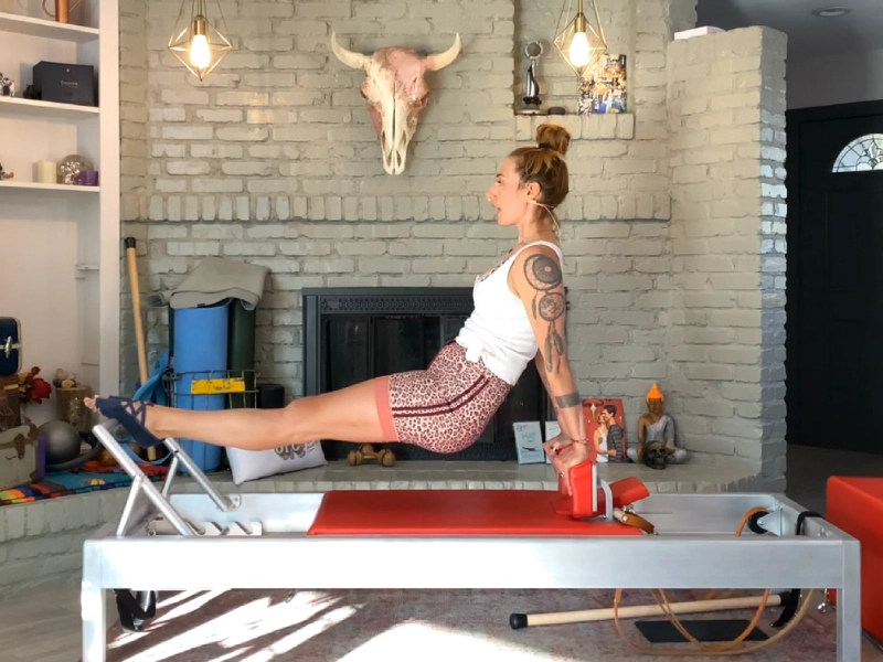 Perform Pilates Control Push Ups Back on the Reformer.