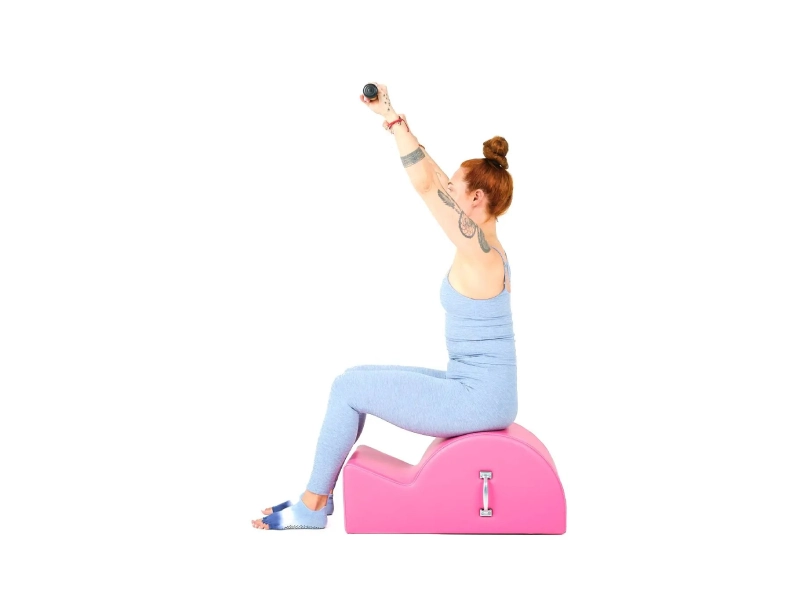 The Pilates Flat exercise is performed on a Spine Corrector.