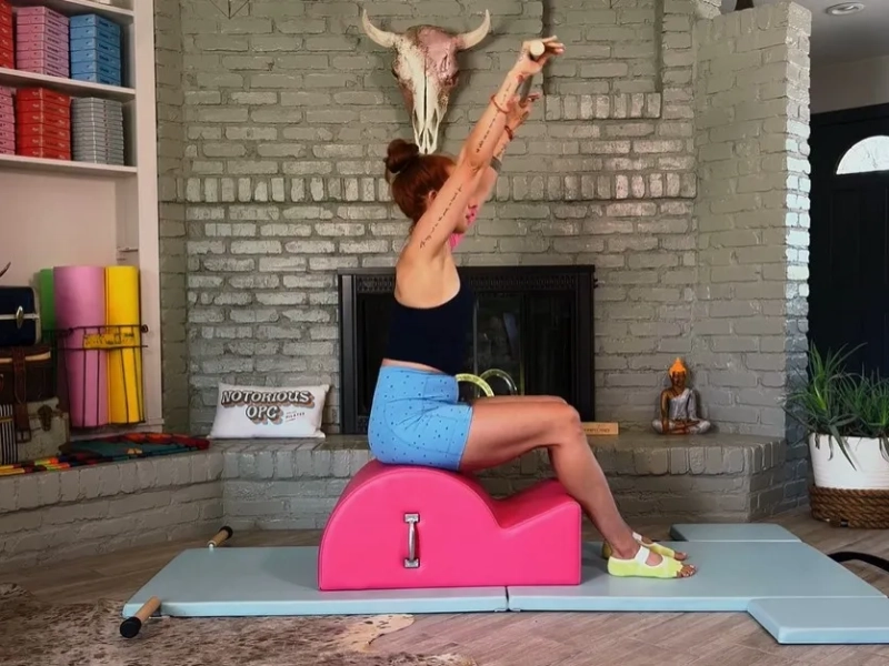 Perform the Pilates Flat Exercise on the Spine Corrector.