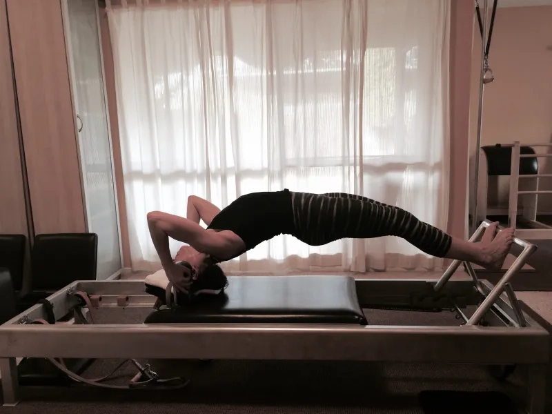 The Headstand Facing Up exercise on the Reformer offers many benefits to the body.