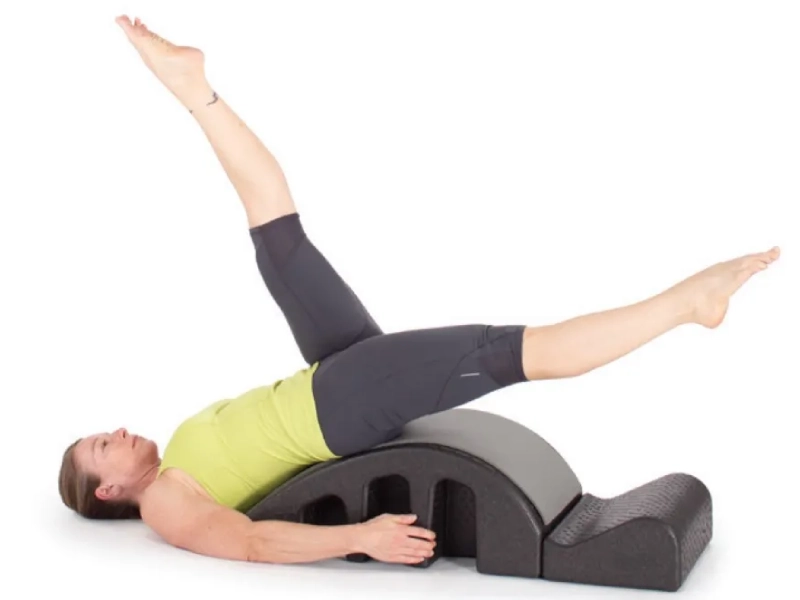 Steps to perform Pilates Helicopter exercises on a Spine Corrector.