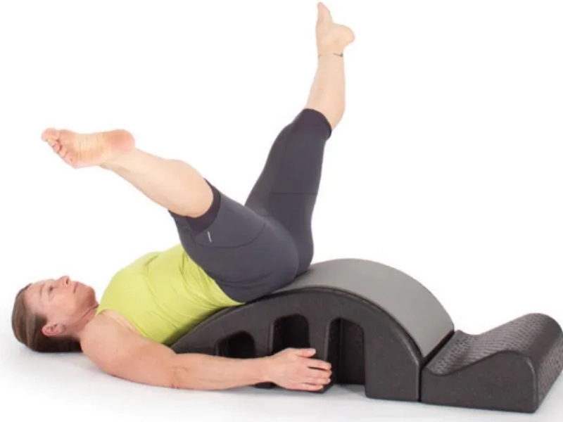 Steps to perform Pilates Helicopter exercises on a Spine Corrector.