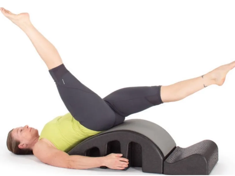Steps to perform Pilates Helicopter exercises on a Spine Corrector.