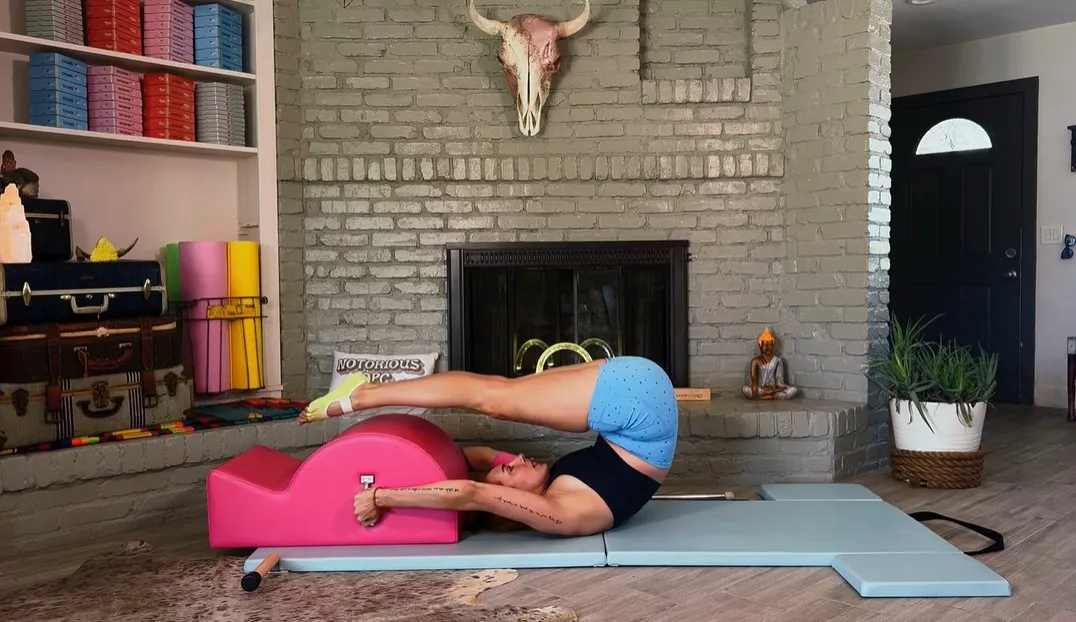 Steps to perform the Pilates Jackknife exercise on a Spine Corrector.