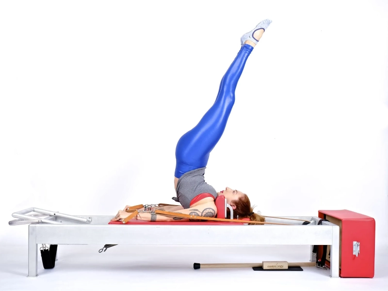 The overhead movement when performed on a Reformer machine.