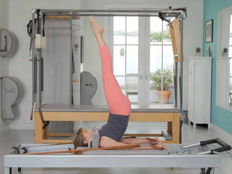 The overhead movement when performed on a Reformer machine.