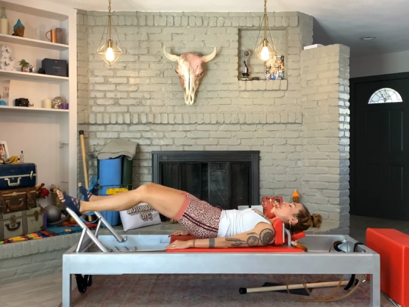 Steps to perform the Pilates Pelvic Lift exercise on a Reformer.