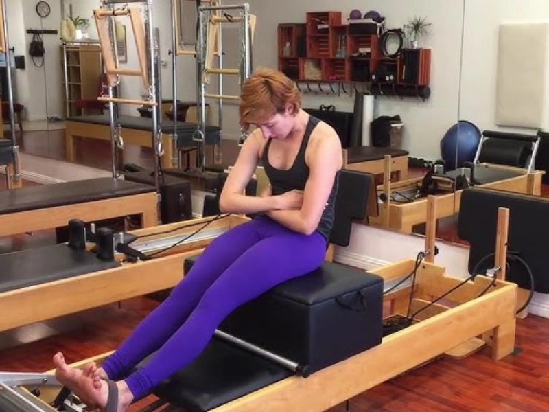 The Round Back exercise on the Reformer helps improve posture and spinal health.