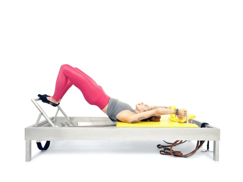 Pilates Semi Circle exercise on the Reformer.