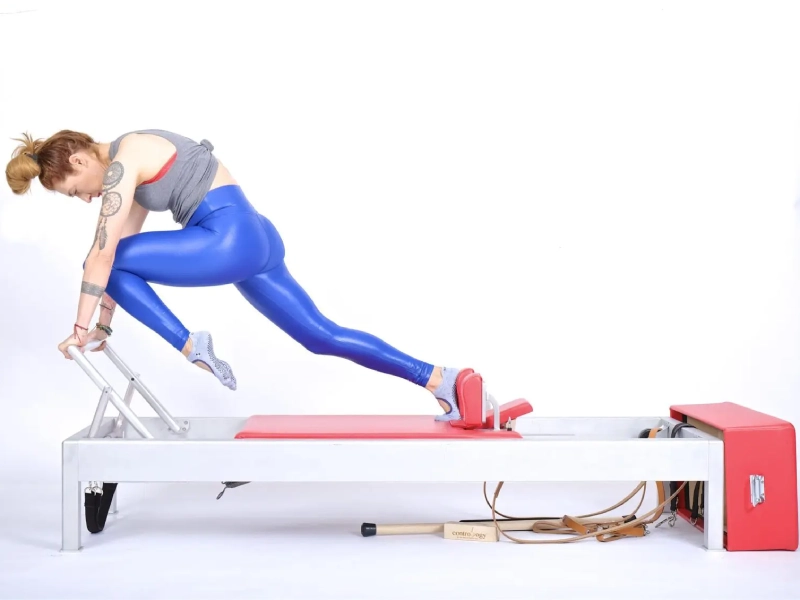 Pilates Single Leg Knees Off Exercise on the Reformer.