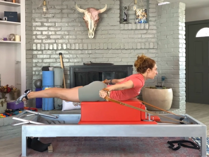 Steps to perform the Pilates T-Pull exercise on a Reformer.