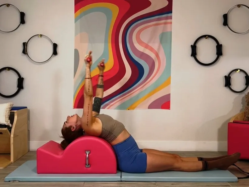 Performing Pilates Circles on the Spine Corrector.