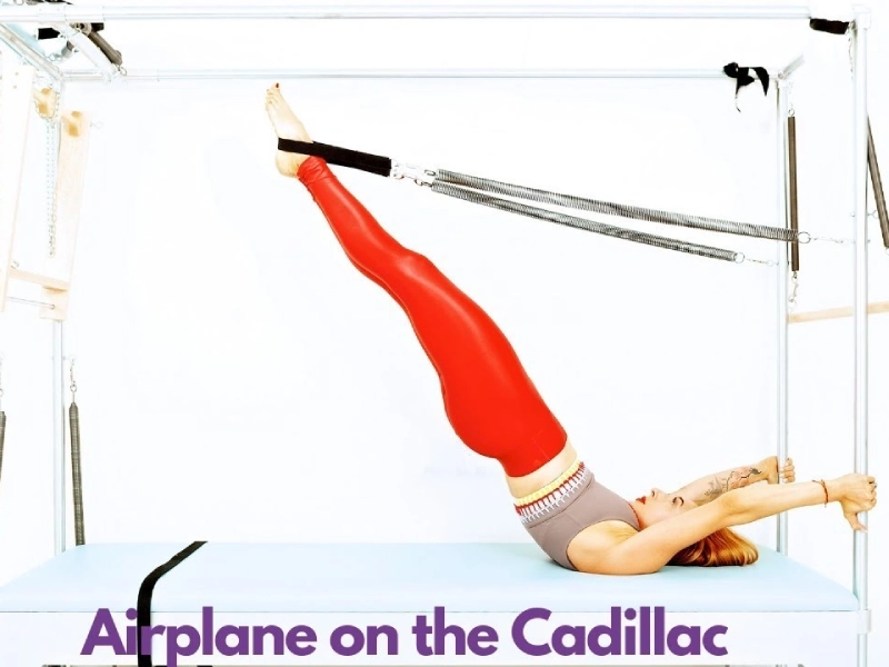 Pilates Airplane exercise on the Cadillac.