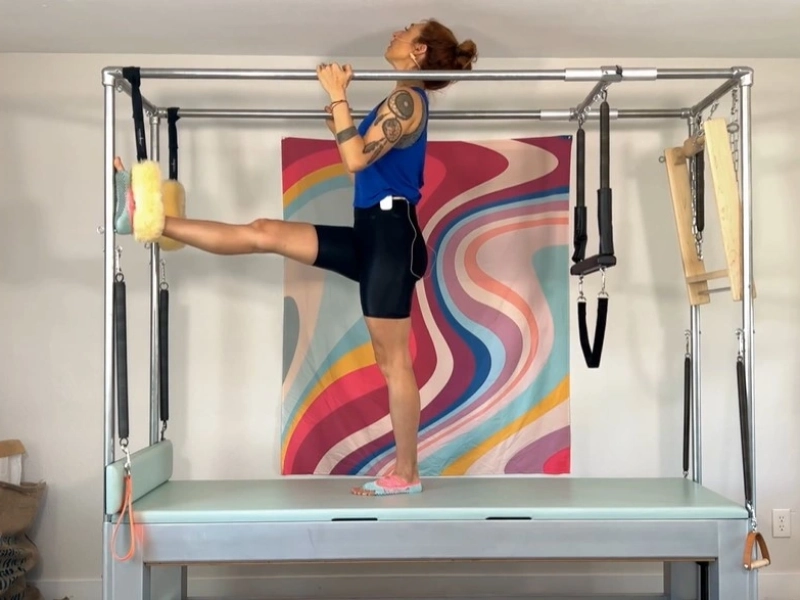 Steps to perform the Pilates Ballet Stretches Front exercise on a Cadillac.