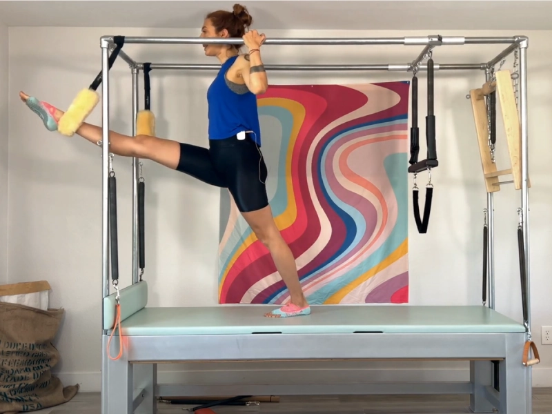 Steps to perform the Pilates Ballet Stretches Front exercise on a Cadillac.