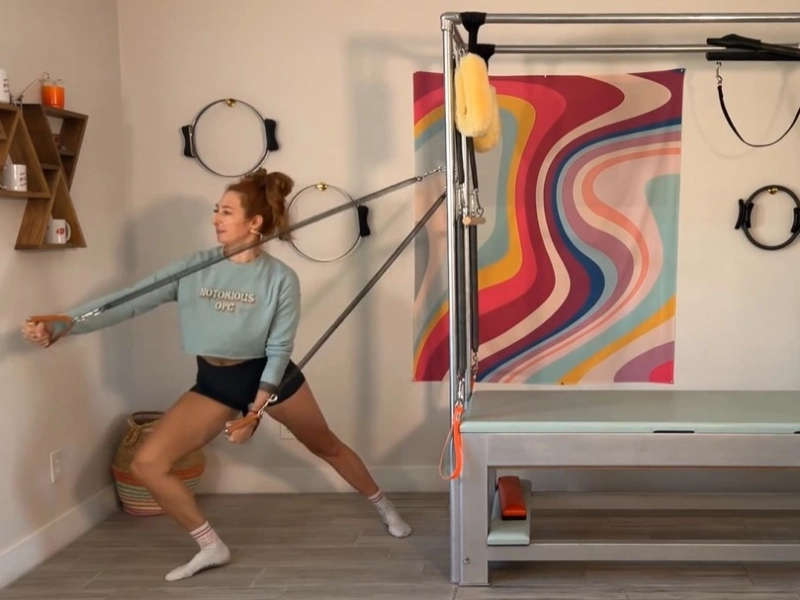 Steps to perform the Pilates Fencing with Standing Arm Springs exercise on the Cadillac.