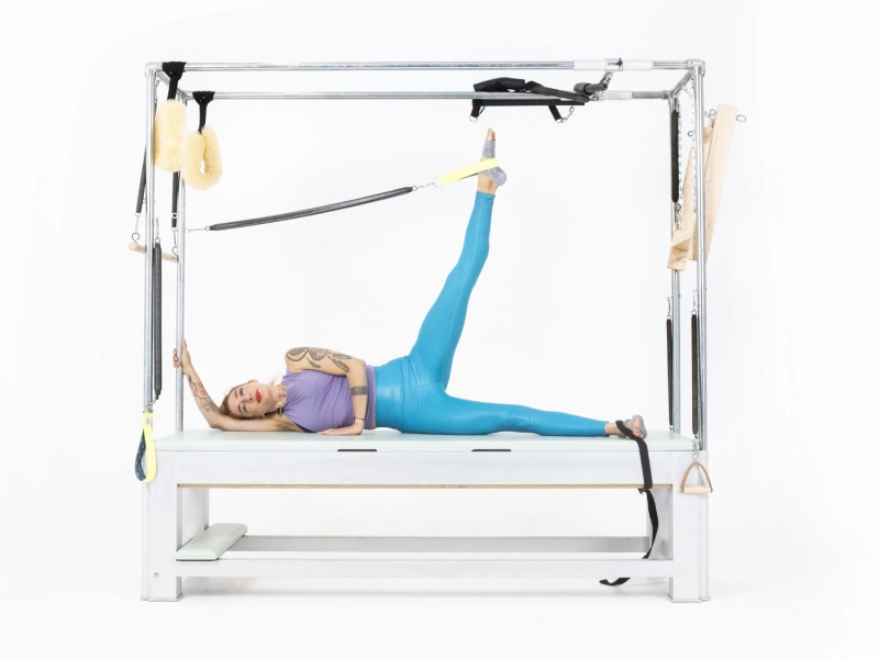 Pilates Side Leg Springs exercise on the Cadillac.