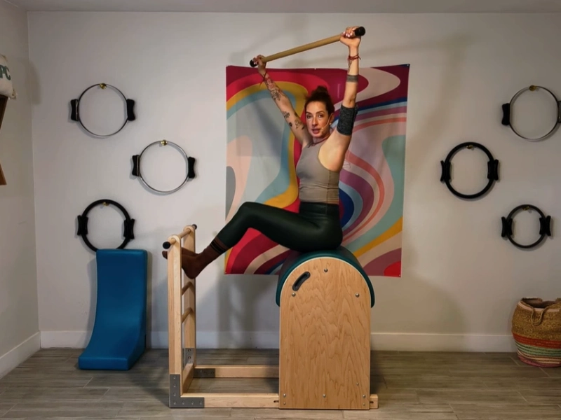 Pilates Twist and Reach exerciseon on the Ladder Barrel.
