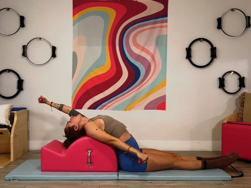 Perform Pilates Up/Down on the Spine Corrector.
