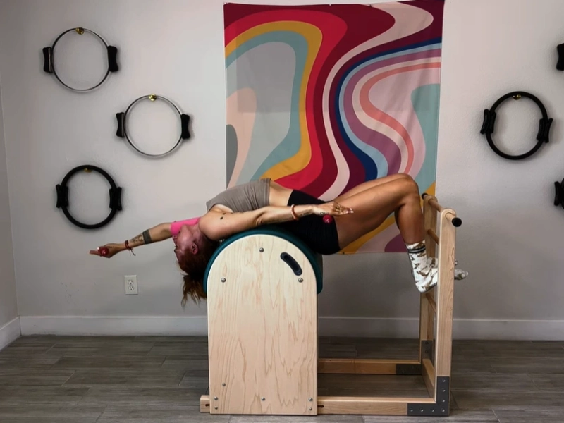 Perform Pilates Up/Down on the Ladder Barrel.